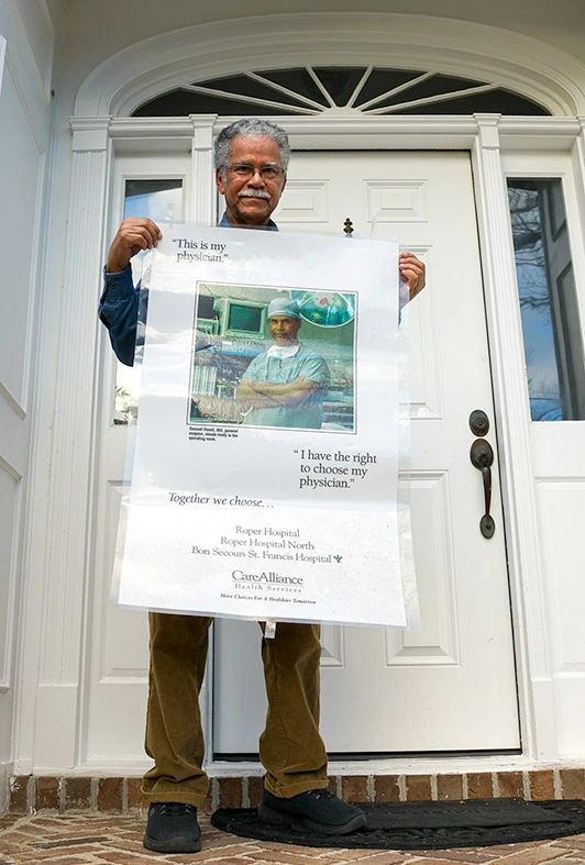 Sam Hazell holding right to choose physician poster
