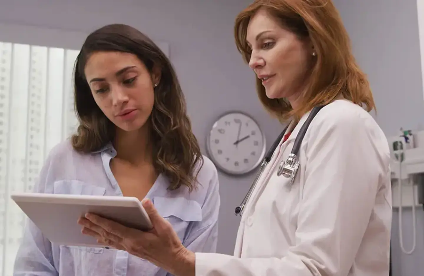 Doctor shows patient ipad