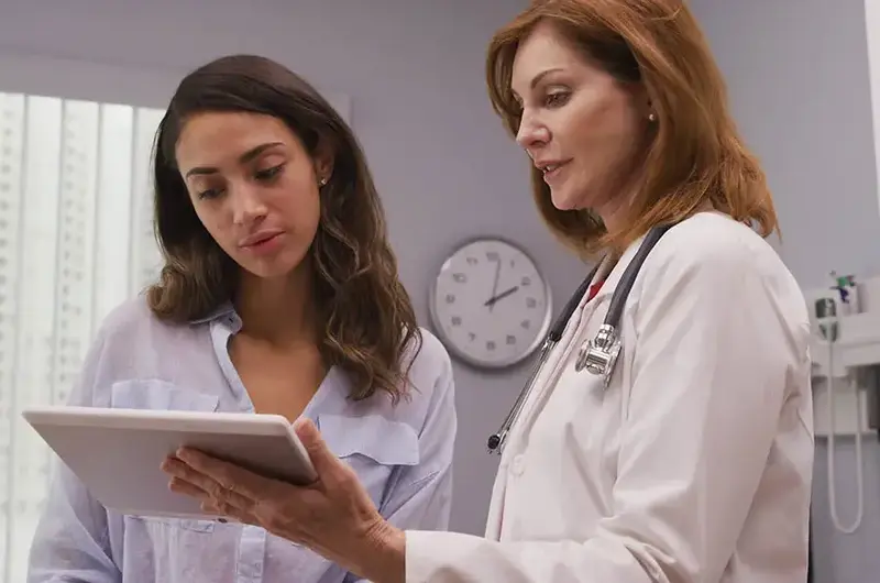 Doctor shows patient ipad