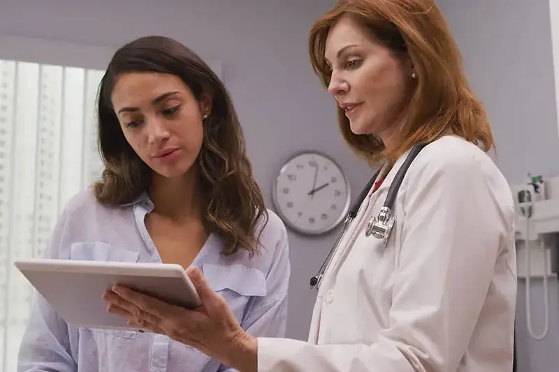 Doctor shows patient ipad