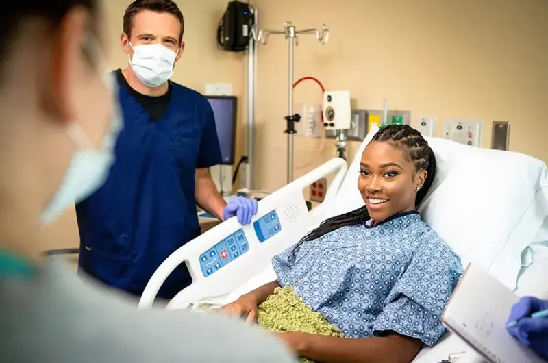 masked nurse with patient flu season