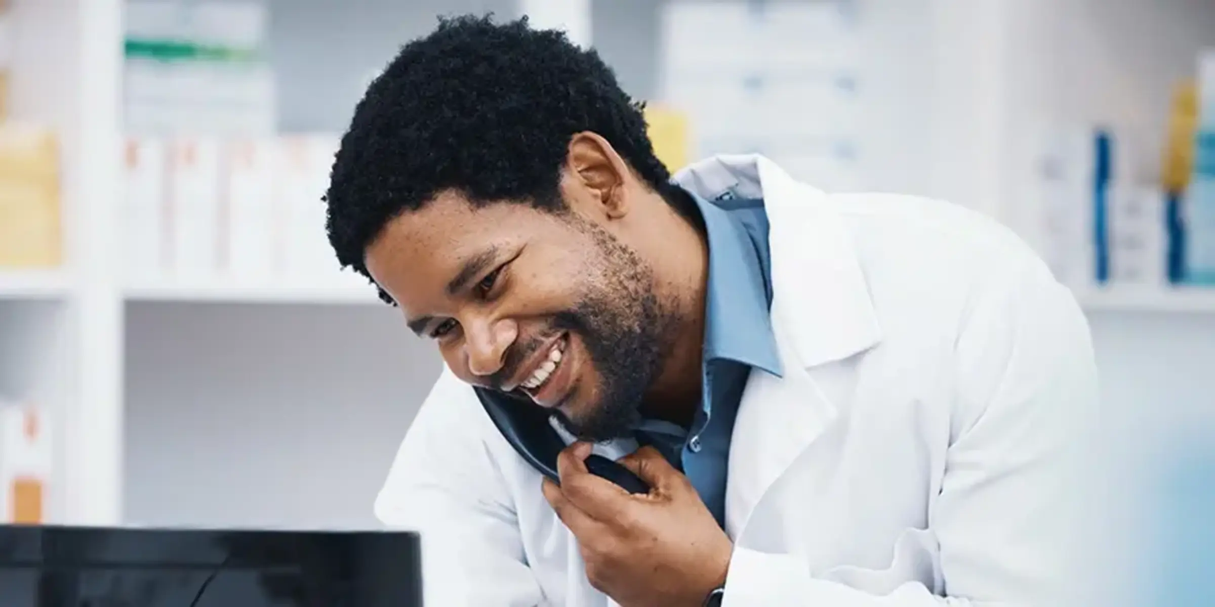 Pharmacist, black man or phone call for patient help