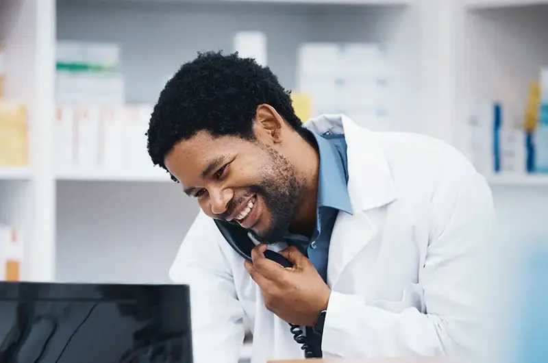 Pharmacist, black man or phone call for patient help