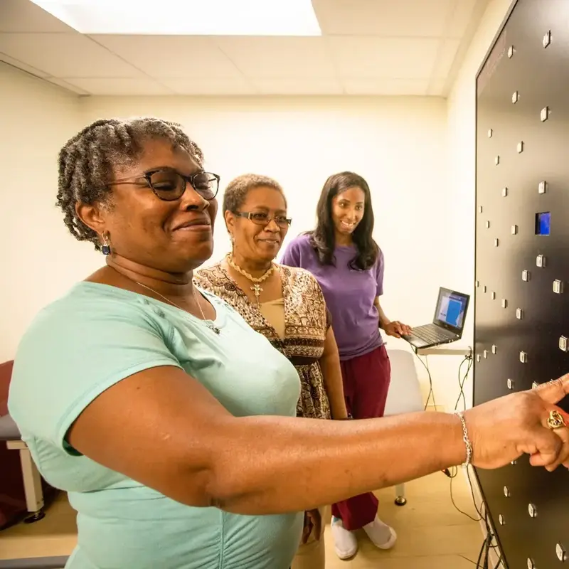 Patient touches therapy wall