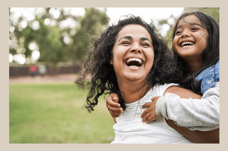 medicaid woman with her child on her back