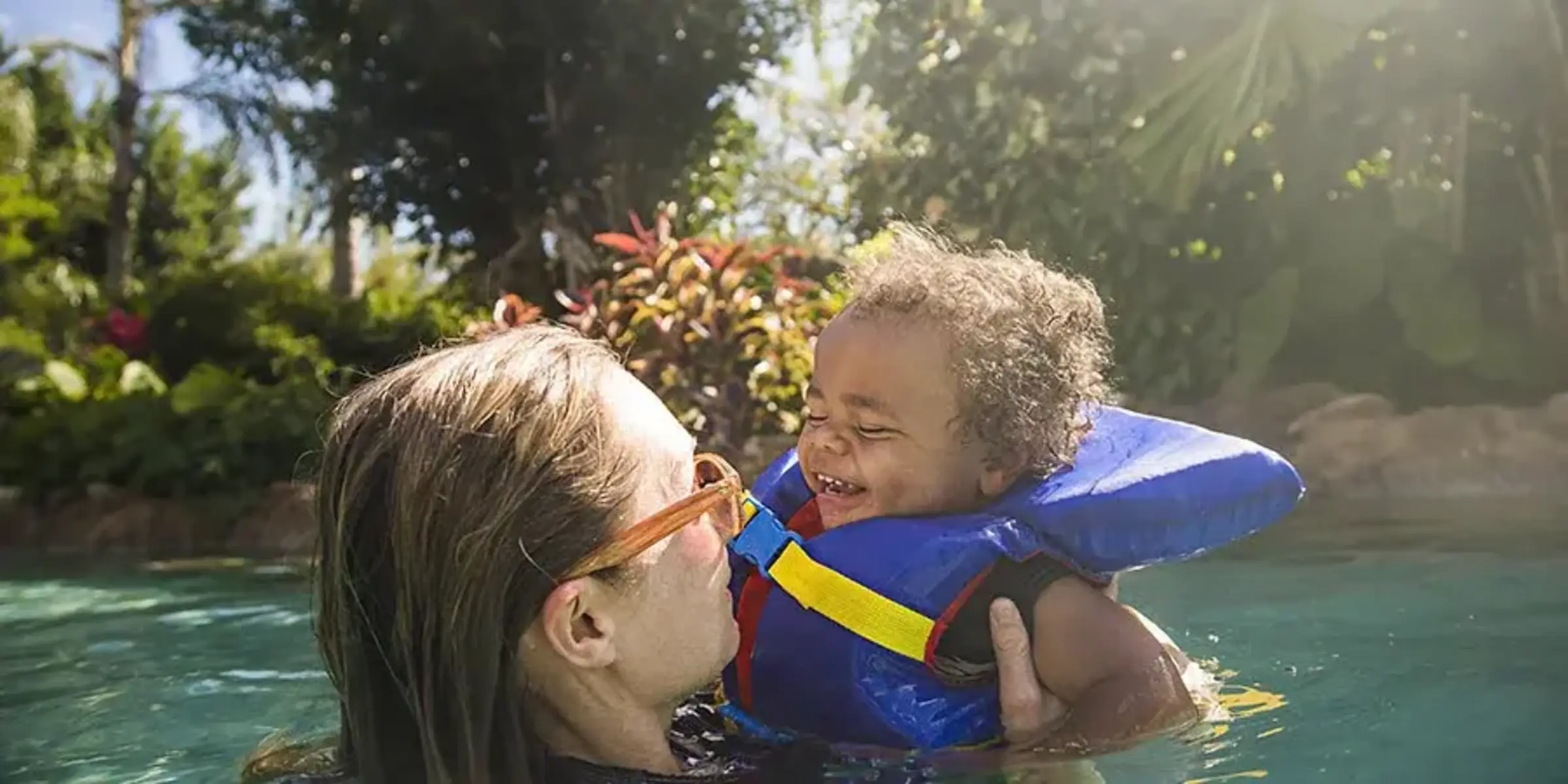 mom and child in the pool
