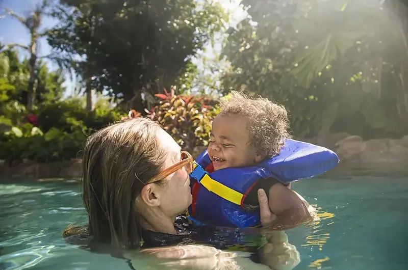 mom and child in the pool