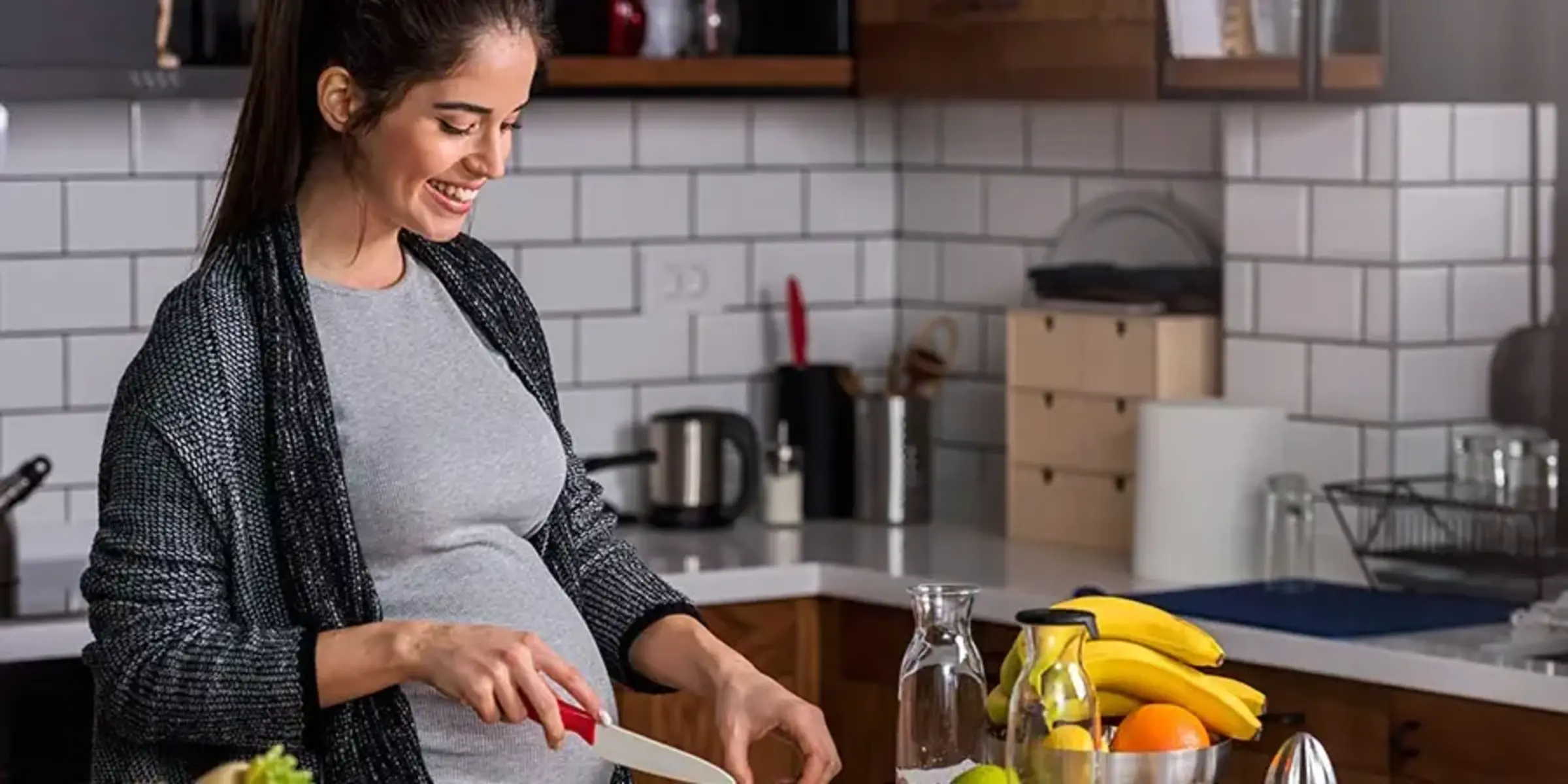 pregnant woman prepping meal