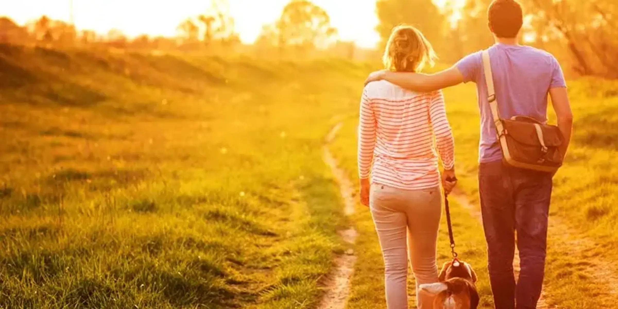 couple walking dog
