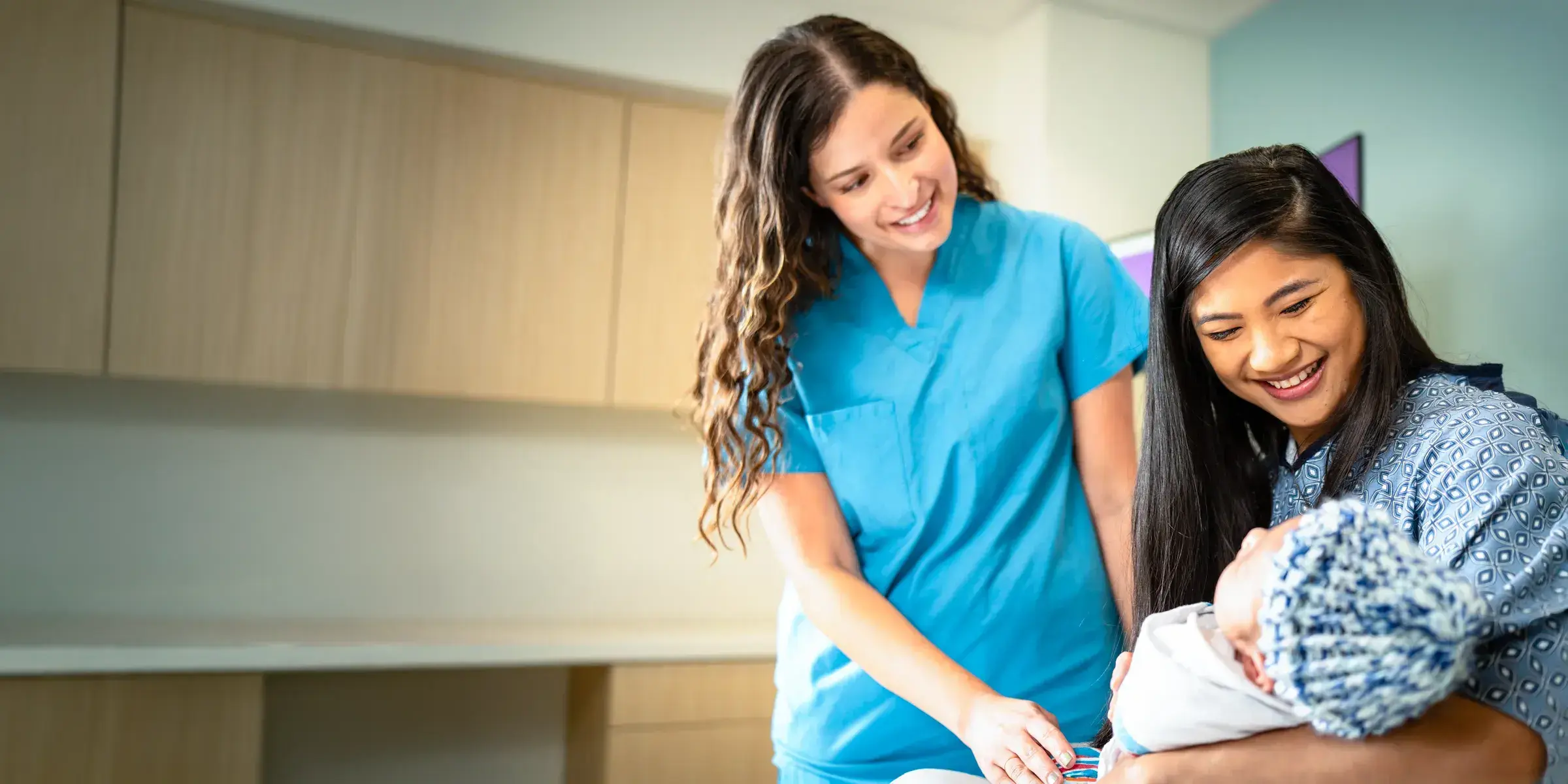 nurse with mom and baby