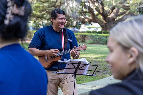 Jose Saravia playing his guitar horticulture therapy
