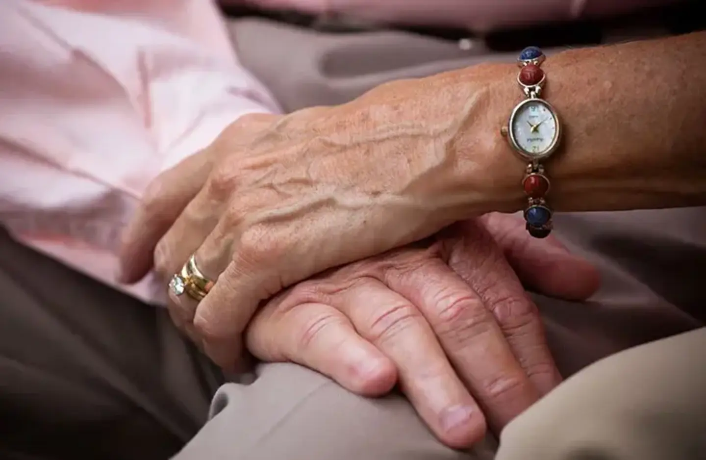Couple hold hands