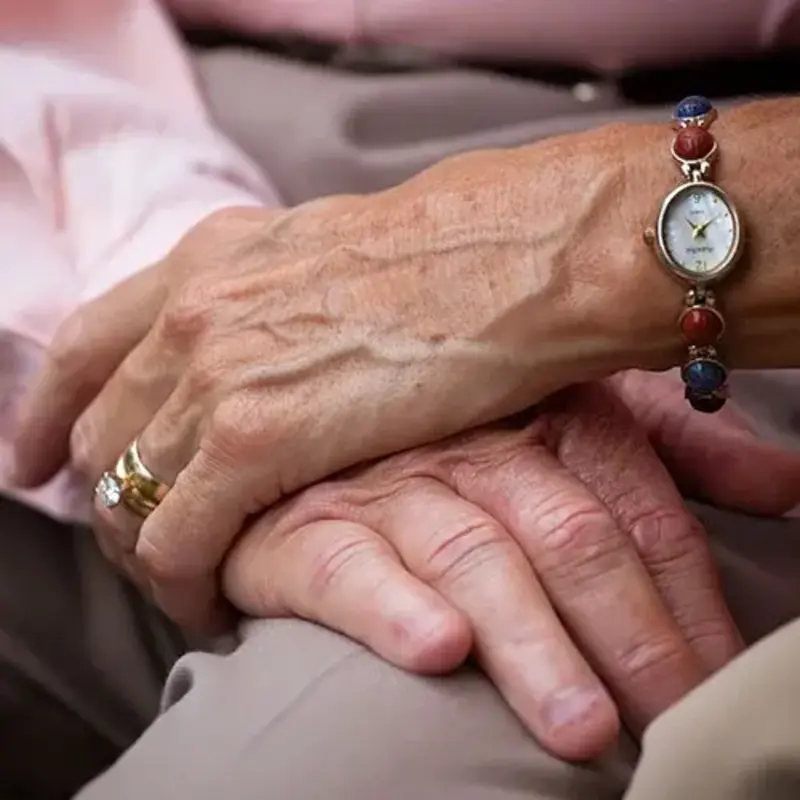 Couple hold hands