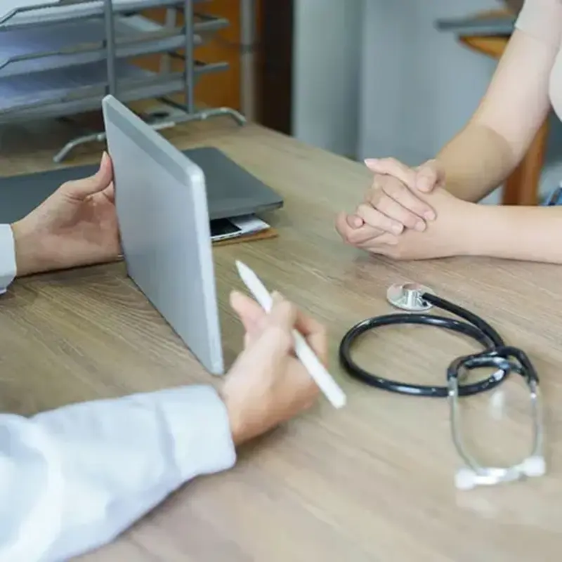 Doctor shows patient ipad