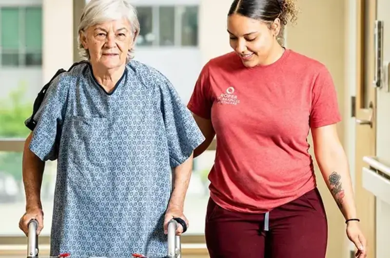 volunteer walking with hospital patient