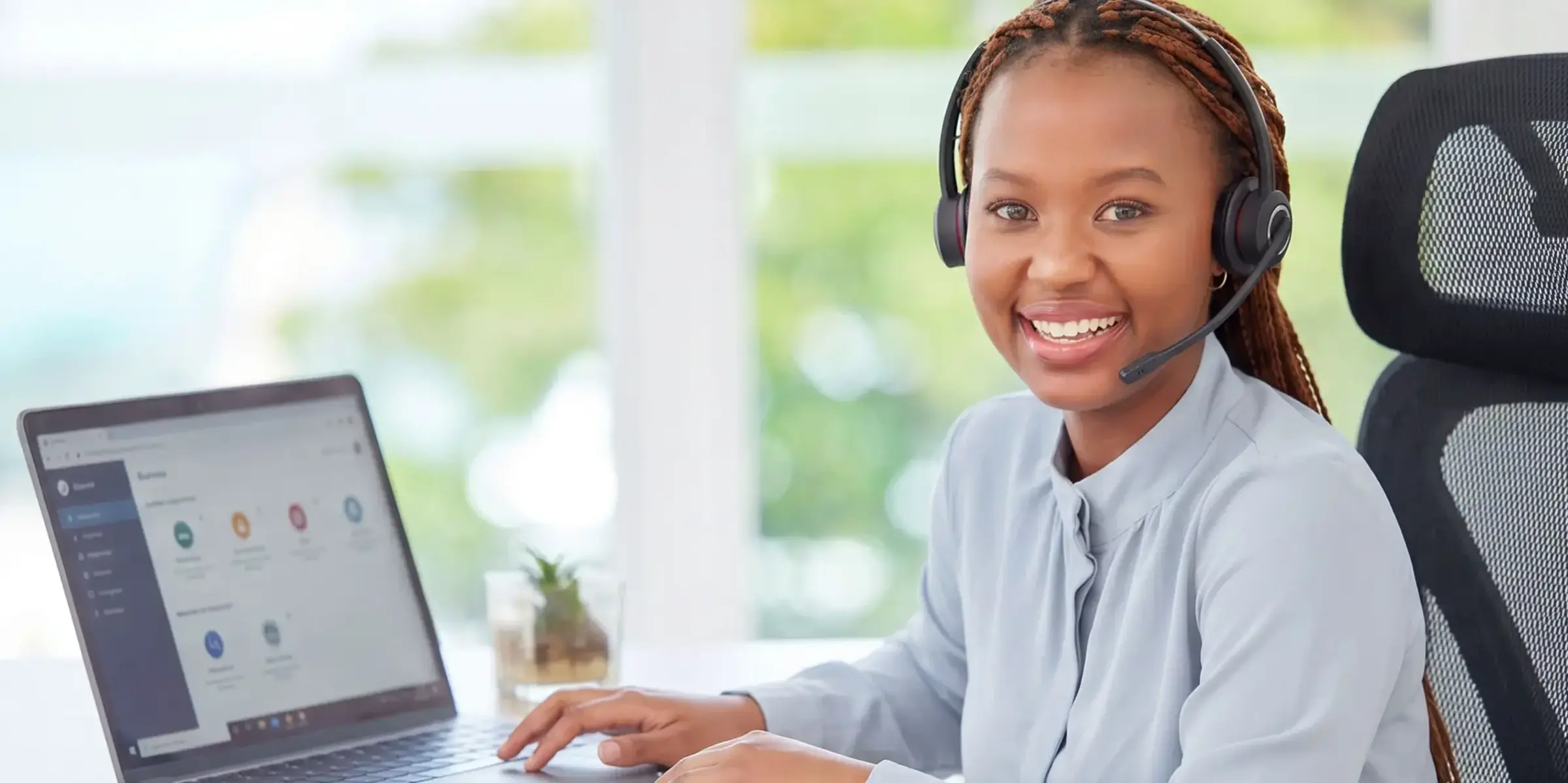 Woman with headset at computer