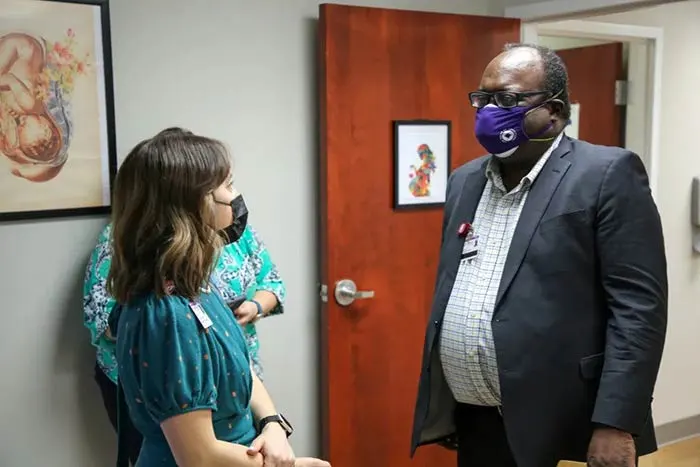 nurses talking to Dr. Moxley