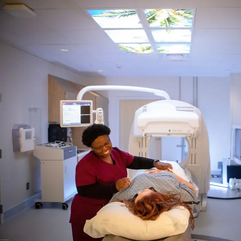 Nurse with patient in NM630 scan