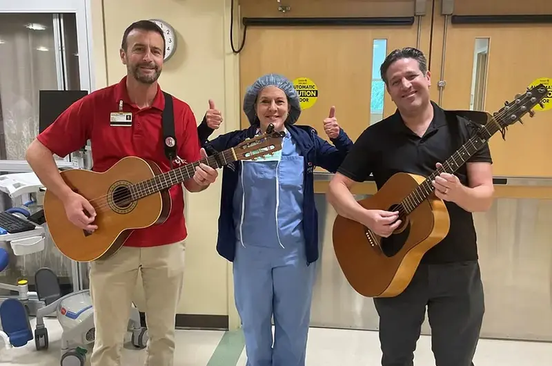 music in medicine nurse with guitarists