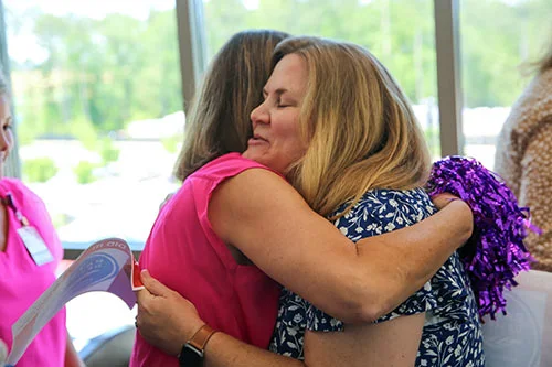 employees hugging