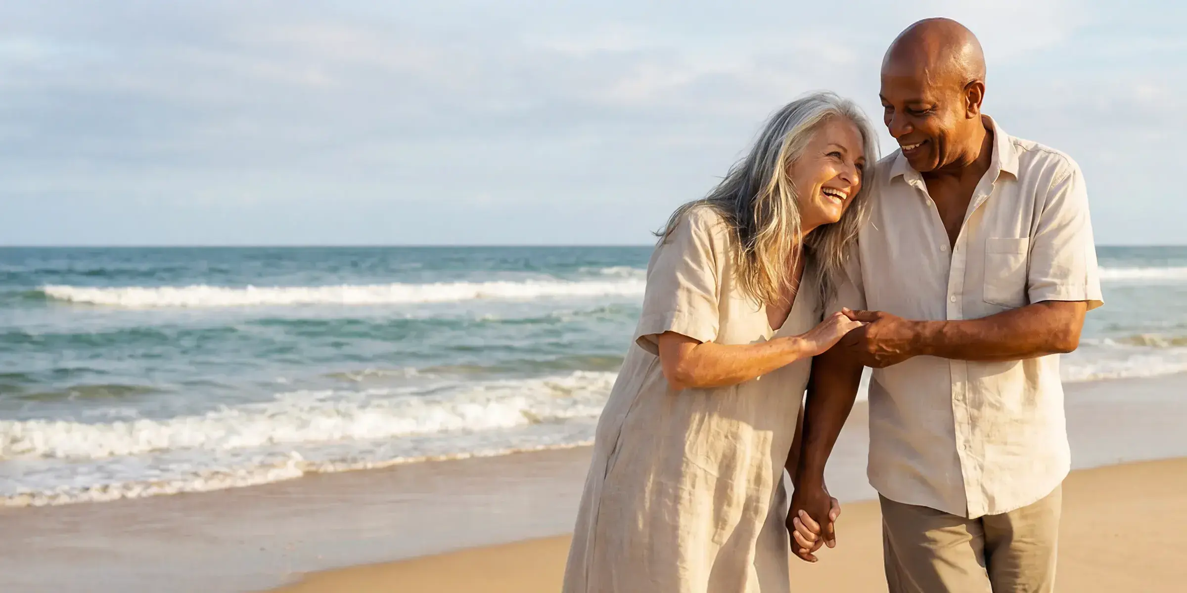 Couple laughing on the beach