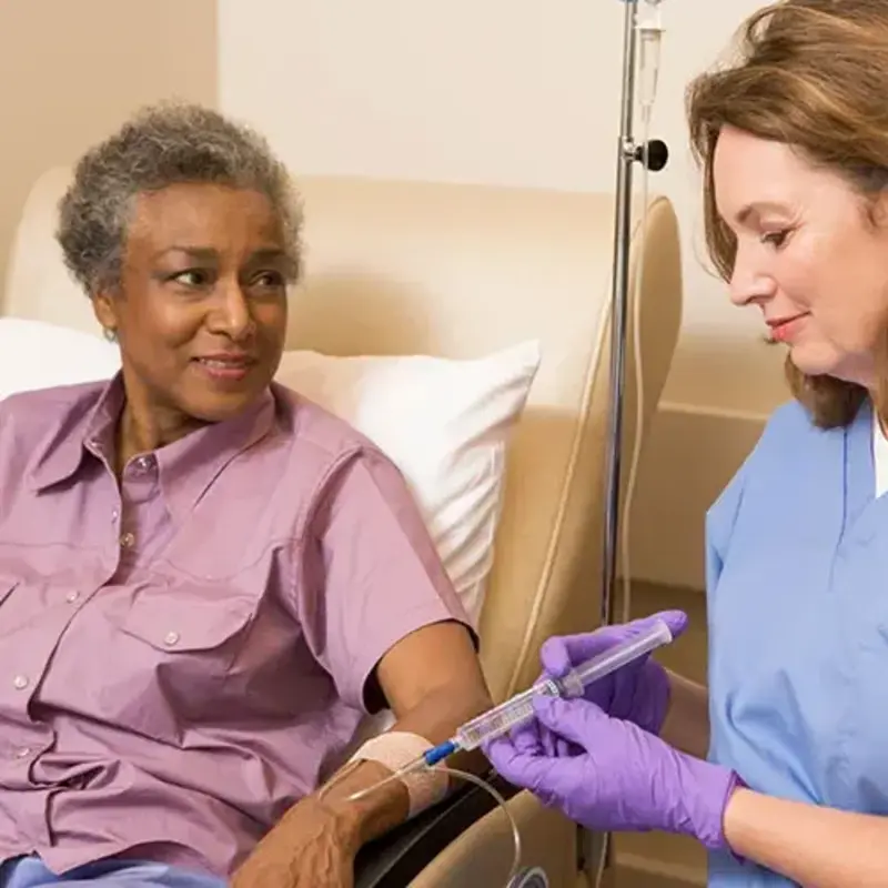 Nurse gives patient chemo