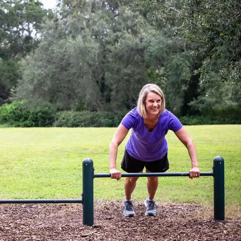 Woman does push ups outside