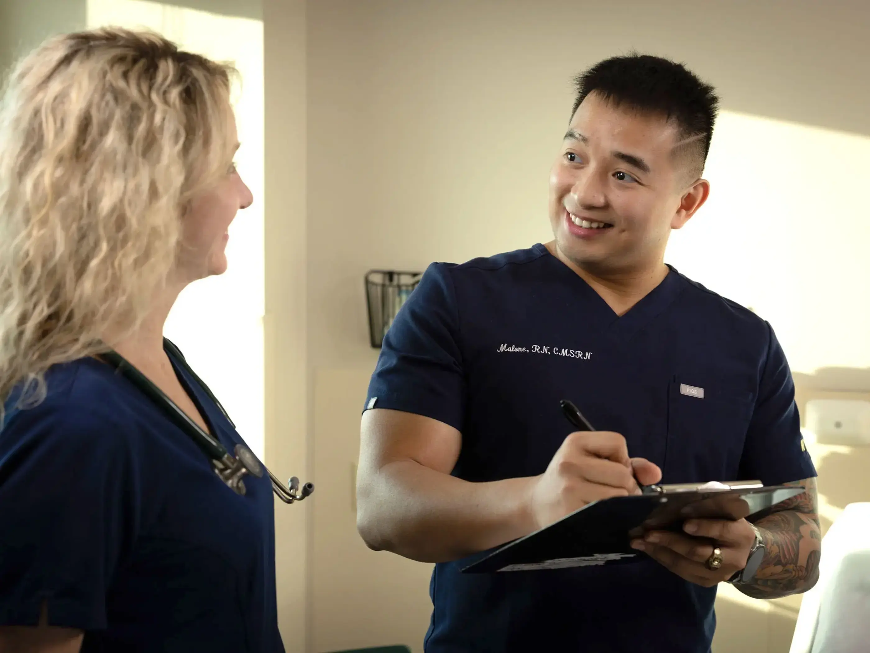 male nurse talking to staff