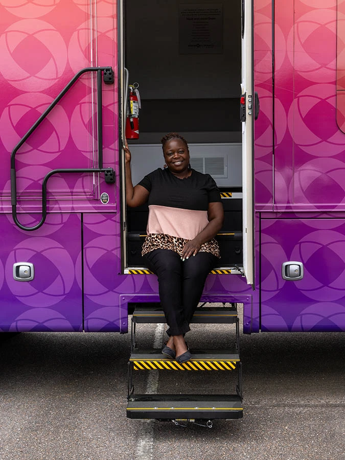 sharonda stokes in the doorway of mobile health unit