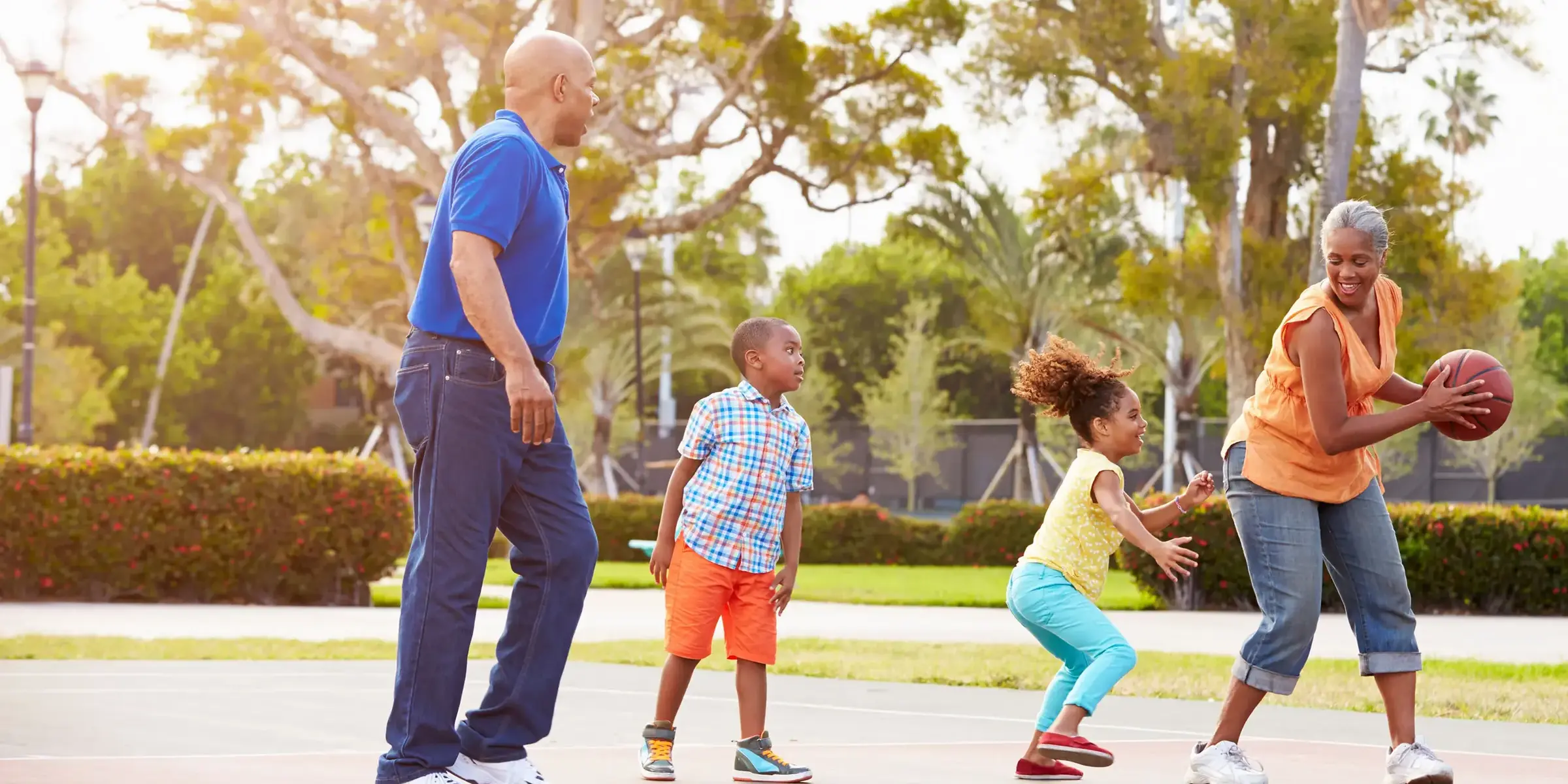 family playing basketball