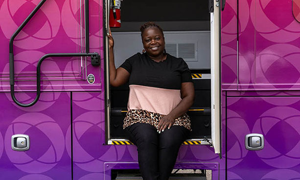 Sharonda in the doorway of the mobile health unit