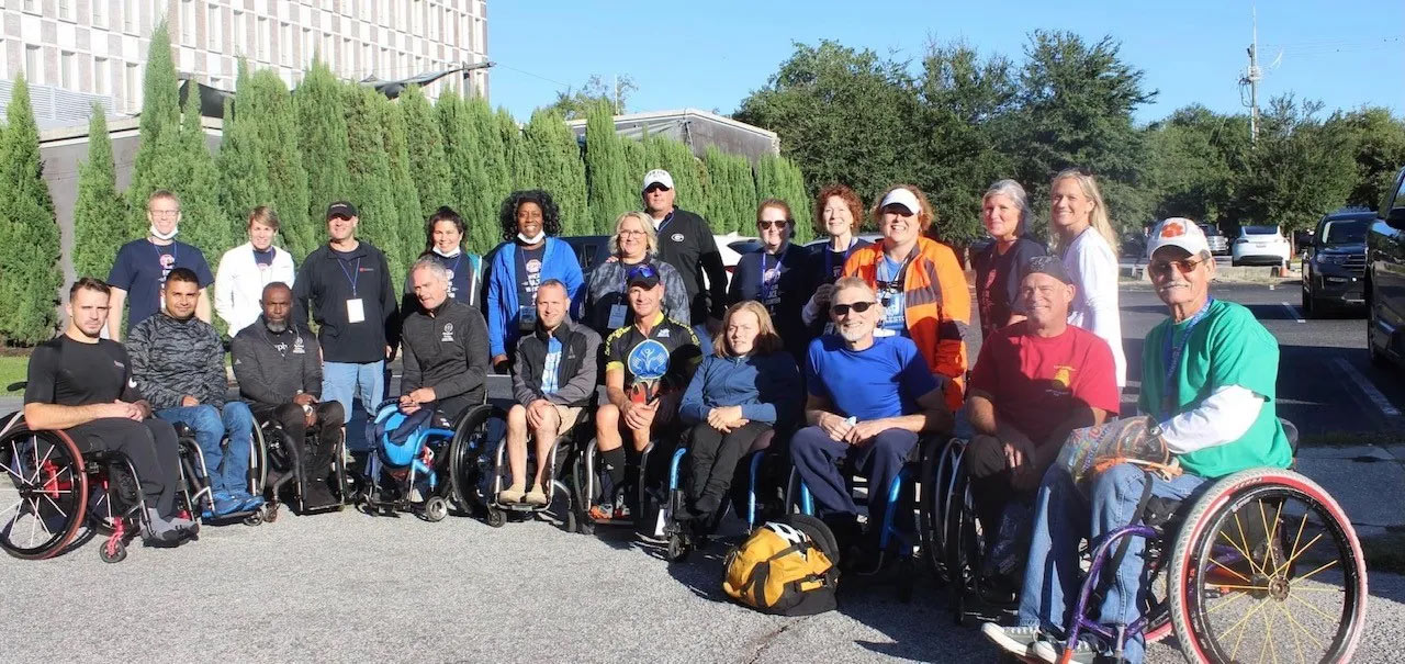 Garic with CRBR wheelchair race competitors and RSFH volunteers in 2021