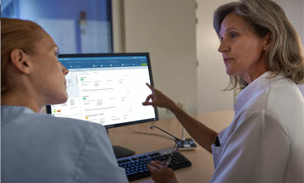 healthcare workers looking at a screen