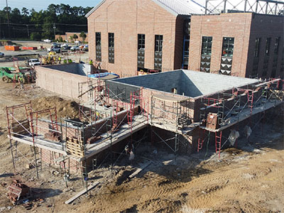 Sawmill east end elevation enclosure masonry progress July 2025 thumbnail