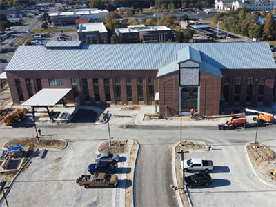 Sawmill building aerial view with parking lot Nov 2025 thumbnail