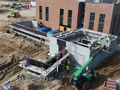 Sawmill east end elevation enclosure masonry progress July 2025 thumbnail