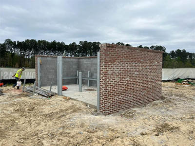 Sawmill mob brick masonary dumpster enclosure March 2026 thumbnail