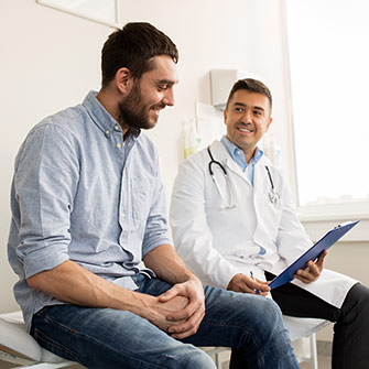 male patient talking to doctor